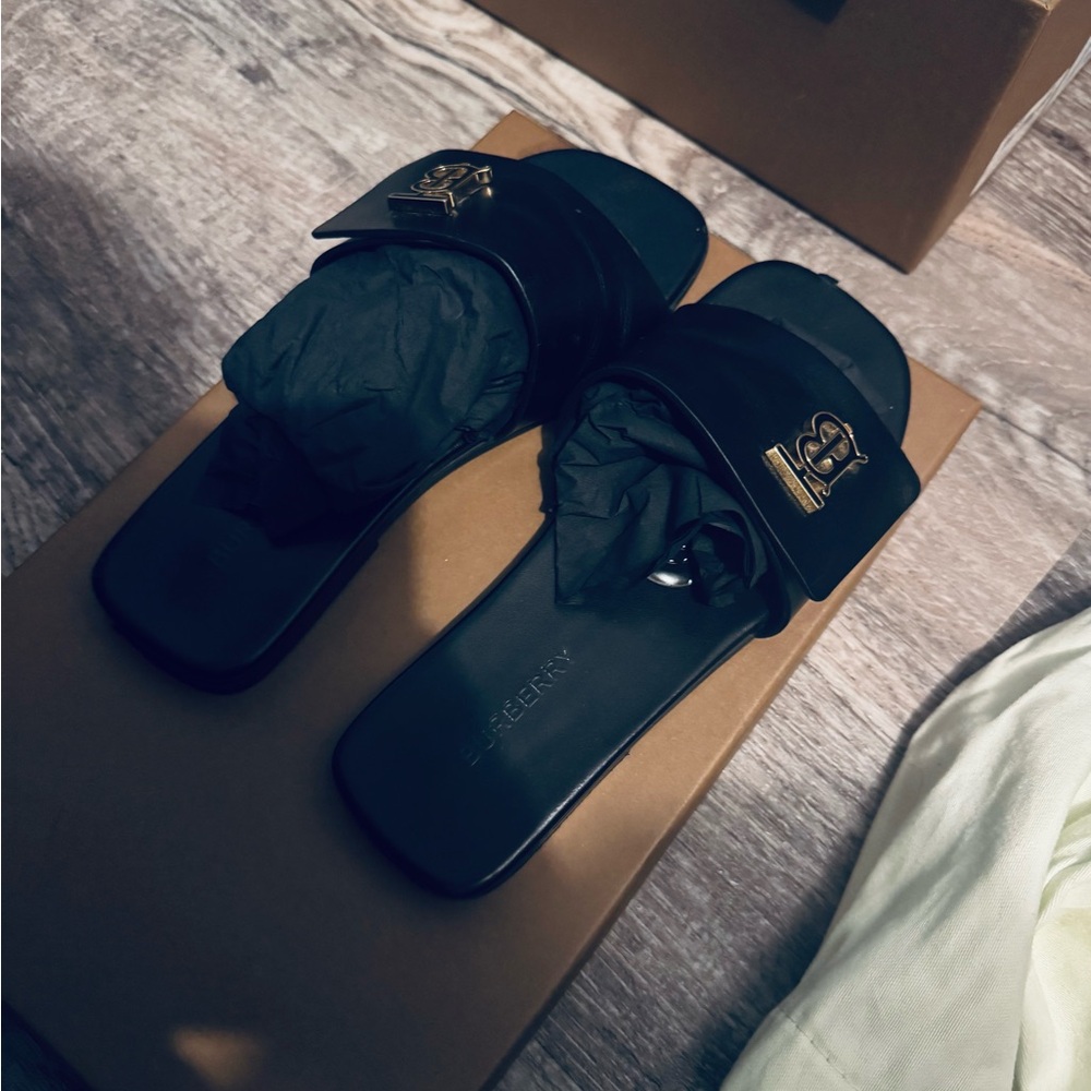 Burberry Black Slides with Gold Emblem